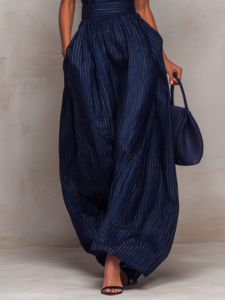 Anna - Mono azul oscuro a rayas con escote en forma de llave y pantalones de pierna ancha