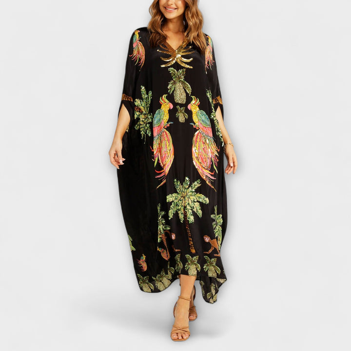 Linda - Impresionante vestido con tirantes asimétricos y estampado de palmeras