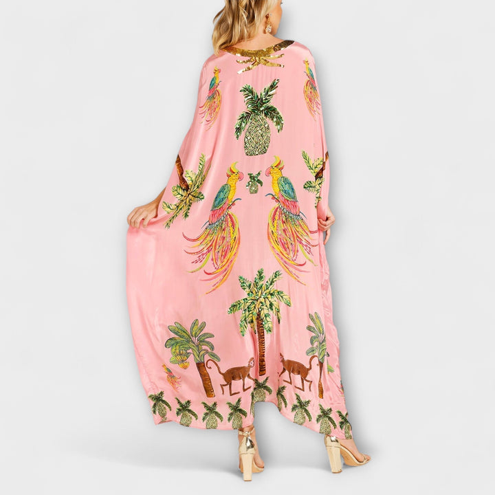 Linda - Impresionante vestido con tirantes asimétricos y estampado de palmeras