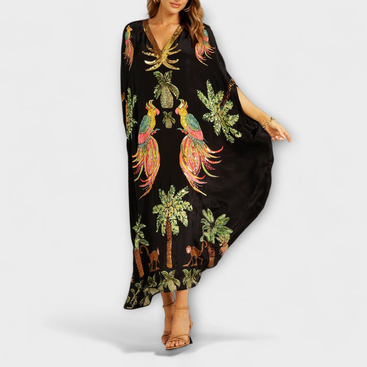 Linda - Impresionante vestido con tirantes asimétricos y estampado de palmeras