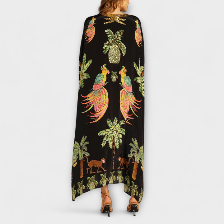 Linda - Impresionante vestido con tirantes asimétricos y estampado de palmeras